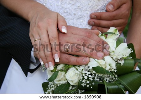 Hands married. Hands newlyweds on background of the bouquet. This photo is not correction.