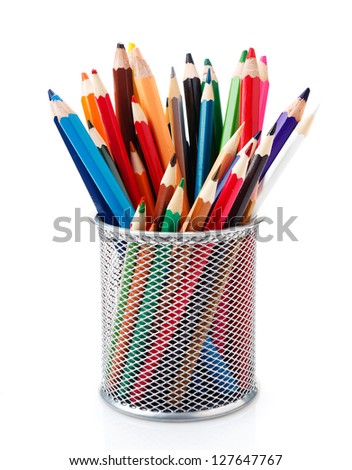 colored pencils in a pencil cup on a white background