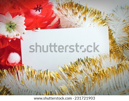 red christmas tree made of feathers with greeting cards