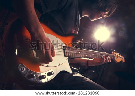 guy playing bass, guitar close-Ã�Â³Ã�Â·