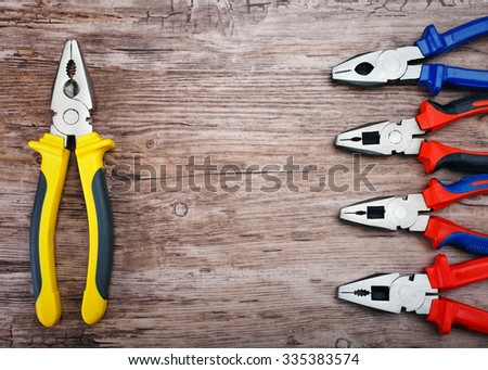 Locking pliers on wooden background, Prepare basic hand tools for work.