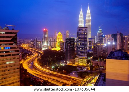 KUALA LUMPUR - DECEMBER 15: The Petronas Twin Towers  are the world's tallest twin towers. The skyscraper height is 451.9m. December 15, 2010, in Kuala Lumpur, Malaysia