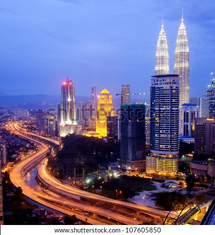 KUALA LUMPUR - DECEMBER 15: The Petronas Twin Towers  are the world\'s tallest twin towers. The skyscraper height is 451.9m. December 15, 2010, in Kuala Lumpur, Malaysia
