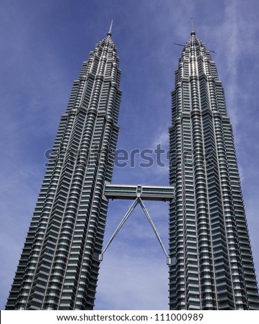KUALA LUMPUR - DECEMBER 15: The Petronas Twin Towers.  These are the world\'s tallest twin towers. The skyscraper height is 451.9m. December 15, 2010, in Kuala Lumpur, Malaysia
