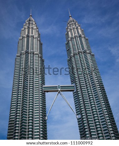 KUALA LUMPUR - DECEMBER 15: The Petronas Twin Towers.  These are the world's tallest twin towers. The skyscraper height is 451.9m. December 15, 2010, in Kuala Lumpur, Malaysia