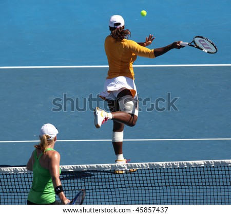 MELBOURNE, AUSTRALIA - JANUARY 26: Serena Williams evades a volley from Bethanie Mattek Sands a doubles match during the Australian Open on January 26, 2010 in Melbourne