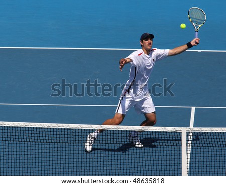 MELBOURNE, AUSTRALIA - MARCH 6: Carsten Ball of Australia hits a volley in the doubles rubber of the Davis Cup tie against Chinese Taipei on March 6, 2010 in Melbourne, Australia