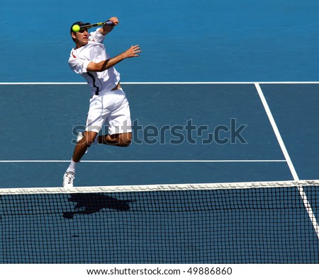 MELBOURNE - MARCH 6: Carsten Ball of Australia hits a volley in the doubles rubber of the Davis Cup tie against Chinese Taipei on March 6, 2010 in Melbourne