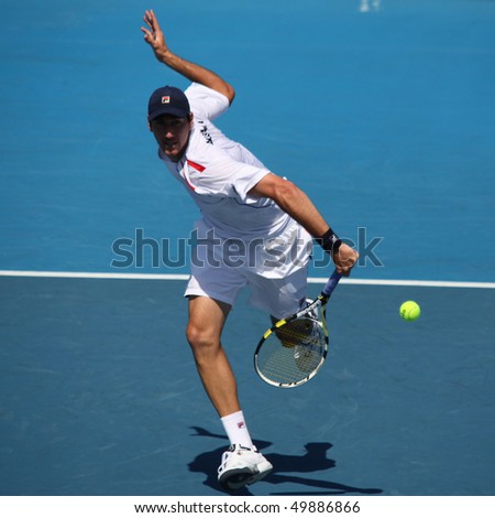 MELBOURNE - MARCH 6: Carsten Ball of Australia hits a volley in the doubles rubber of the Davis Cup tie against Chinese Taipei on March 6, 2010 in Melbourne