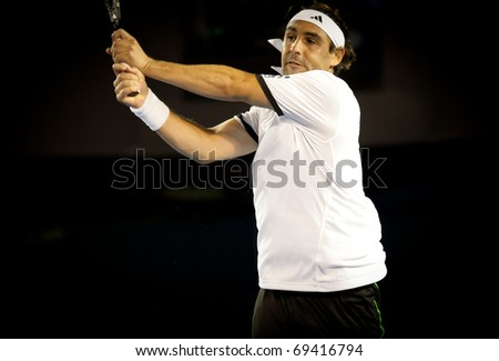 MELBOURNE - JANUARY 19: Marcos Baghdatis of Cyprus in his second round win over Juan Martin Del Potro of Argentina in the 2011 Australian Open on January 19, 2011 in Melbourne, Australia.