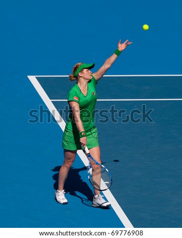 MELBOURNE - JANUARY 22: Kim Clijsters of Belgium in her third round win over Alize Cornet of France in the 2011 Australian Open - January 22, 2011 in Melbourne