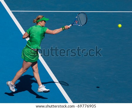 MELBOURNE - JANUARY 22: Kim Clijsters of Belgium in her third round win over Alize Cornet of France in the 2011 Australian Open - January 22, 2011 in Melbourne