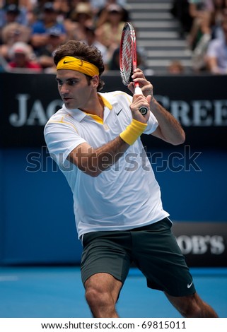 MELBOURNE - JANUARY 25: Roger Federer of Switzerland in his quarter final  win over Stanislas Wawrinka of Switzerland in the 2011 Australian Open on January 25, 2011 in Melbourne, Australia.