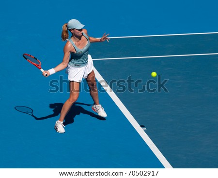 MELBOURNE - JANUARY 22: Alize Cornet of France in her third round loss to Kim Clijsters of Belgium in the 2011 Australian Open - January 22, 2011 in Melbourne