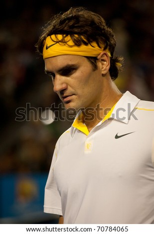 MELBOURNE - JANUARY 19: Roger Federer of Switzerland in his second round win over Gilles Simon of France in the 2011 Australian Open on January 19, 2011 in Melbourne, Australia