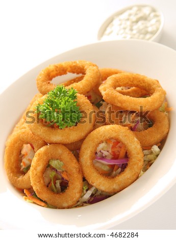 Onion Rings served on a bed of coleslaw salad and tartar sauce