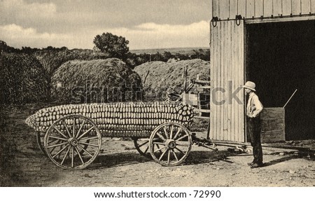 Vintage hoax photo of farmer with huge ear of corn