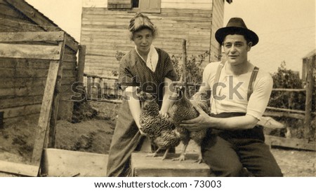 Vintage photo of rural couple with chickens, circa 1900