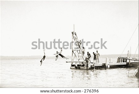 Vintage Photo of People Diving Into Water