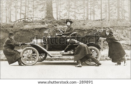 Vintage Photo of People Pushing Old Car