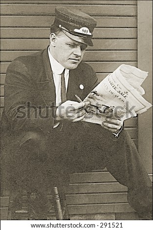 Vintage photo of a Railroad Worker Reading Newspaper in Train Station