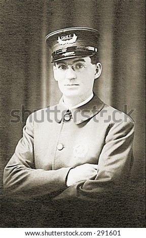 Vintage photo of a Police Chief With Folded Arms