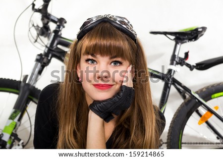 The pretty, young girl with bike. Isolated on white.