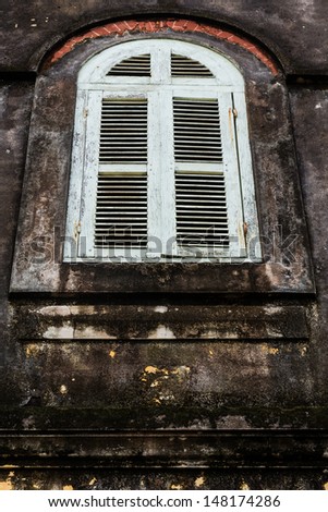 Vintage windows on old brick wall