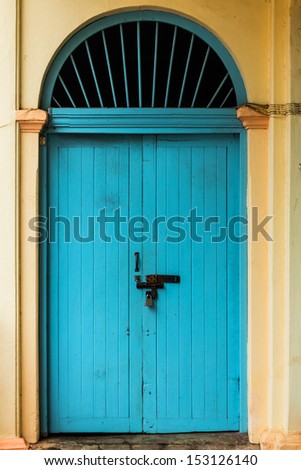 wooden front door to the house, colonial old building style at Nong Khai, Thailand.