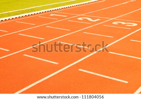 White finish line on the orange track and field tartan