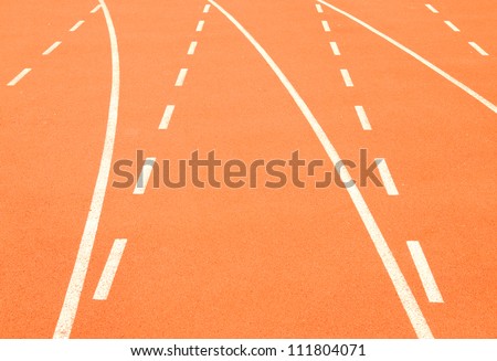 White lines on the orange track and field tartan