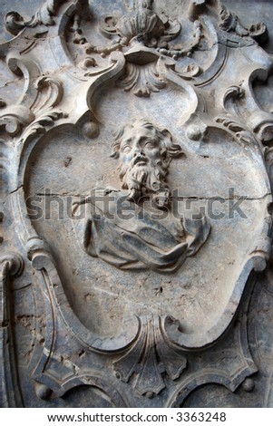 Ornament and sacral relief of a saint on an outside facade of Murcia\'s cathedral
