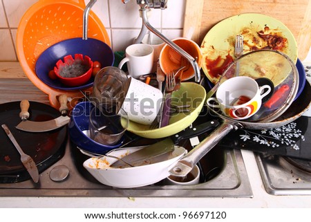 huge heap of dirty dishes waiting for the flatmate