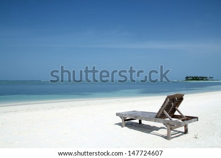 Deckchair on the White Sand Beach of Bodufinolhu (Fun Island), South Male Atoll, Maldives