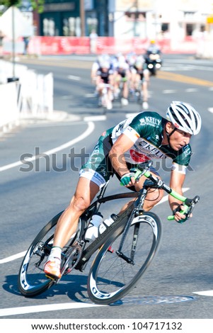 ARLINGTON, VIRGINIA - JUNE 9: A cyclist leads the pack in the Masters 40+ race at the U.S. Air Force Cycling Classic on June  9, 2012 in Arlington, Virginia
