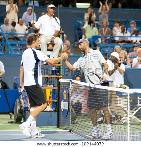 WASHINGTON - AUG 1: James Blake (USA) shakes hands with Marco Chiudinelli (SUI) after Blake took the match at the Citi Open tennis tournament on August 1, 2012 in Washington.