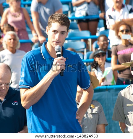 WASHINGTON - AUGUST  4, 2013:  John Isner (USA) speaks to the crowd after losing to Juan Martin del Potro (ARG, not pictured) at he Citi Open tennis tournament on August 4, 2013 in Washington
