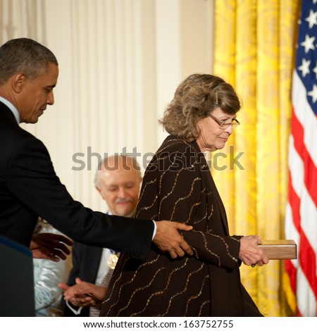 Washington - November 20: Dr. Linnea Smith accepts the Presidential Medal of Freedom for husband Dean Smith at The White House on November 20, 2013 in Washington, DC.  Mr. Smith was ill.