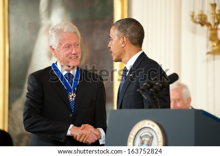 Washington - November 20: Former President Bill Clinton Shakes Hands With President Obama After Receiving The Presidential Medal Of Freedom At The White House On November 20, 2013 In Washington, Dc.