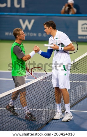 WASHINGTON - JULY 31: Lleyton Hewitt  (AUS) and Milos Raonic (CAN) shake hands after their match at the Citi Open tennis tournament on July 31, 2014 in Washington DC. Raonic won.