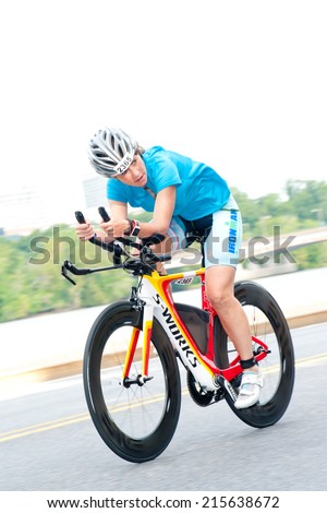 WASHINGTON - SEPTEMBER 7: A cyclist competes in the Nation\'s Triathlon on September 7, 2014 in Washington, D.C.