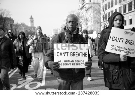 WASHINGTON - DECEMBER 13: Protesters march against police shootings and racism during a rally in  Washington, DC on December 13, 2014