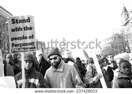 WASHINGTON - DECEMBER 13: Protesters march against police shootings and racism during a rally in  Washington, DC on December 13, 2014