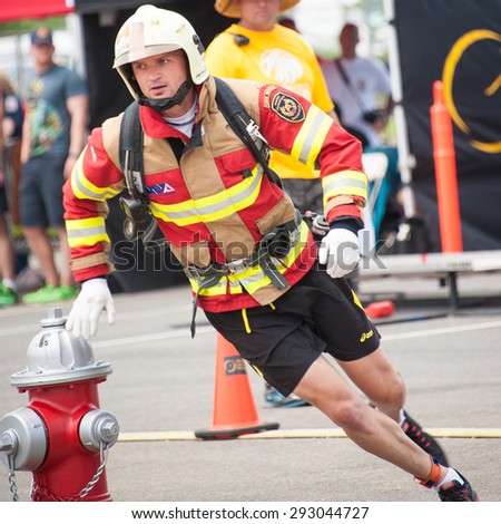 FAIRFAX, VA - JULY 3: A competitor runs the obstacle course in the Ultimate Firefighter competition at the World Police & Fire Games on July 3, 2015