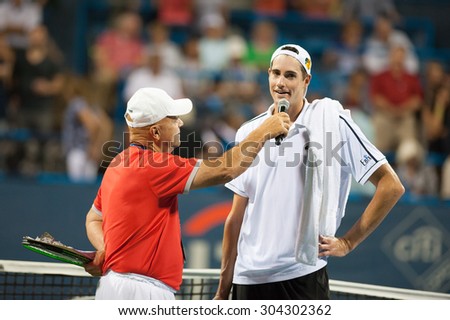 WASHINGTON - AUGUST 7: John Isner (USA) is interviewed after his win over Ricardas Berankis (LTU, not pictured) at the Citi Open tennis tournament on August 7, 2015 in Washington DC