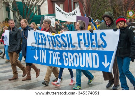 WASHINGTON - NOVEMBER 29:  Marchers take part in the Global Climate March in Washington, DC on November 29, 2015, the eve of the United Nations Climate Change Conference in Paris.