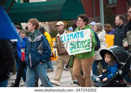 WASHINGTON - NOVEMBER 29: Marchers take part in the Global Climate March in Washington, DC on November 29, 2015, the eve of the United Nations Climate Change Conference in Paris.