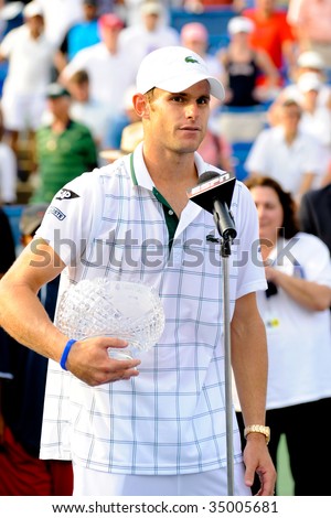 WASHINGTON- AUGUST 9:Andy Roddick (USA) holds his trophy after being defeated by Juan Martin Del Potro (ARG) in the championship match of the Legg Mason Tennis Classic on August 9, 2009 in Washington