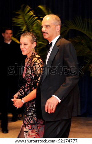WASHINGTON MAY 1 - Attorney General Eric Holder and wife arrive at the White House Correspondents Association Dinner May 1, 2010 in Washington, D.C.