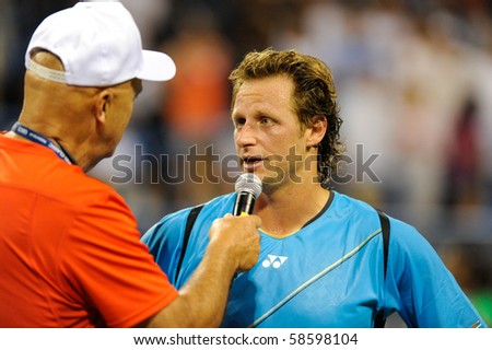 WASHINGTON - AUGUST 6: David Nalbandian (ARG) is interviewed after defeating Gilles Simon (FRA, not pictured) in quarterfinal action at the Legg Mason Tennis Classic on August 6, 2010 in Washington.